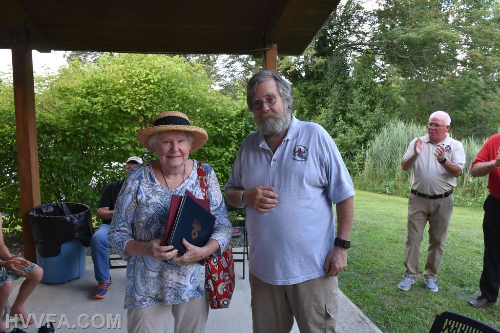 DCFFM President presenting a Certificate to Renate Pogge for 50 Years